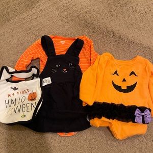 2 body suits, one skirt and a bib